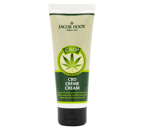 Et rør med Jacob Hooy CBD creme på en hvid baggrund.